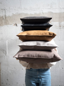 pile of handmade leather pillow at M AAH