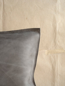 detail of edge on handmade leather pillow at M AAH