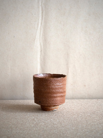 red brown wood fired ceramic cup by Tomasz Niedziolka