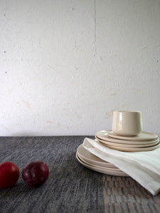 handmade tableware combined with linen napkin and table cloth