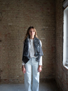 natural lamb skin jacket worn open with a light blouse and jeans