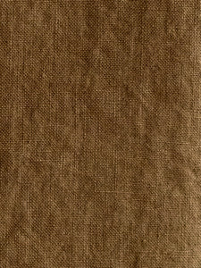 close-up of mustard coloured napkin at M AAH