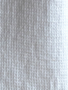 detail of waffle structure on a white linen napkin by Linge Particulier