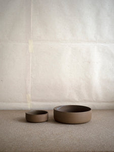 dark brown stoneware bowls in two sizes