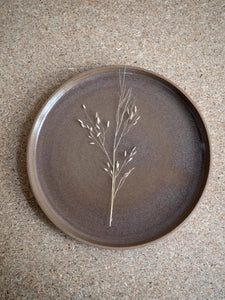 top view of brown stoneware plate with transparant glaze