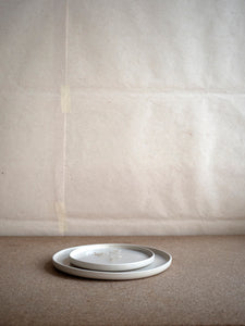 small and big white plate by Inês Soares