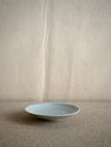 small handmade ceramic plate in light grey glaze at M AAH