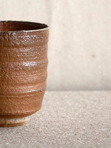 red brown unglazed finish on a unique ceramic piece