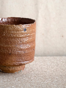 close-up of finish of a unglazed ceramic cup fired in a wood fired kiln