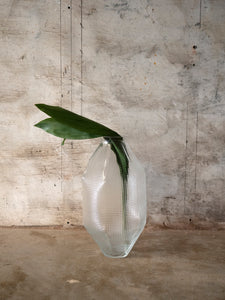 Vanessa Mitrani's long transparent vase with flowers