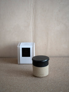 packaging of natural clay and black glaze scented candle with natural wax
