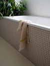 washed linen Mustard yellow guest towel by Libeco